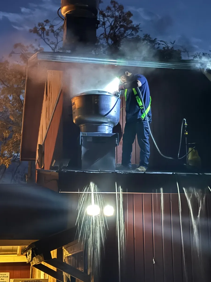 Steam rising from fan during hot-water cleaning